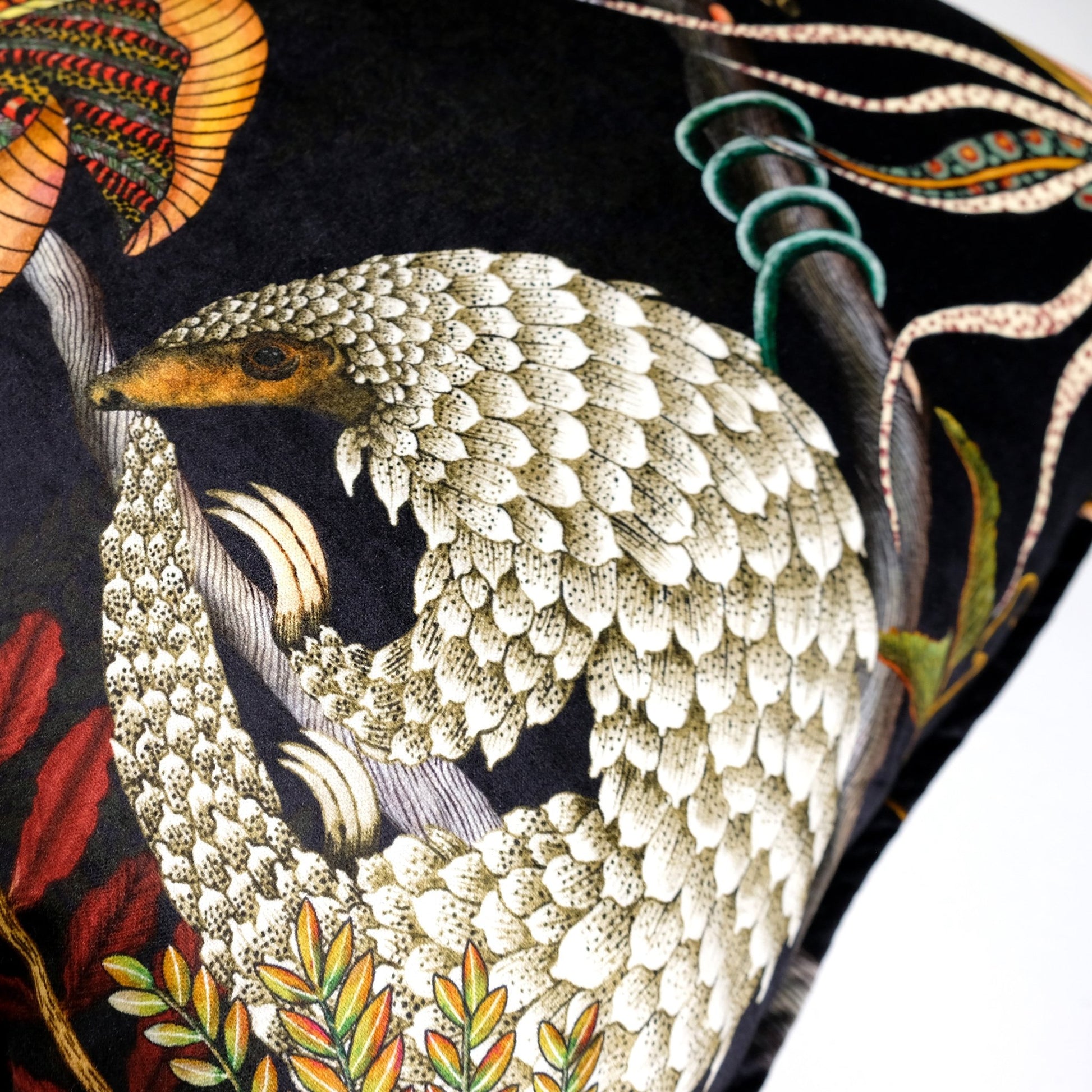 Close-up of the intricate pangolin design on the Thanda Pangolin in Night Velvet Cushion Cover, showcasing the fine craftsmanship and textured details.
