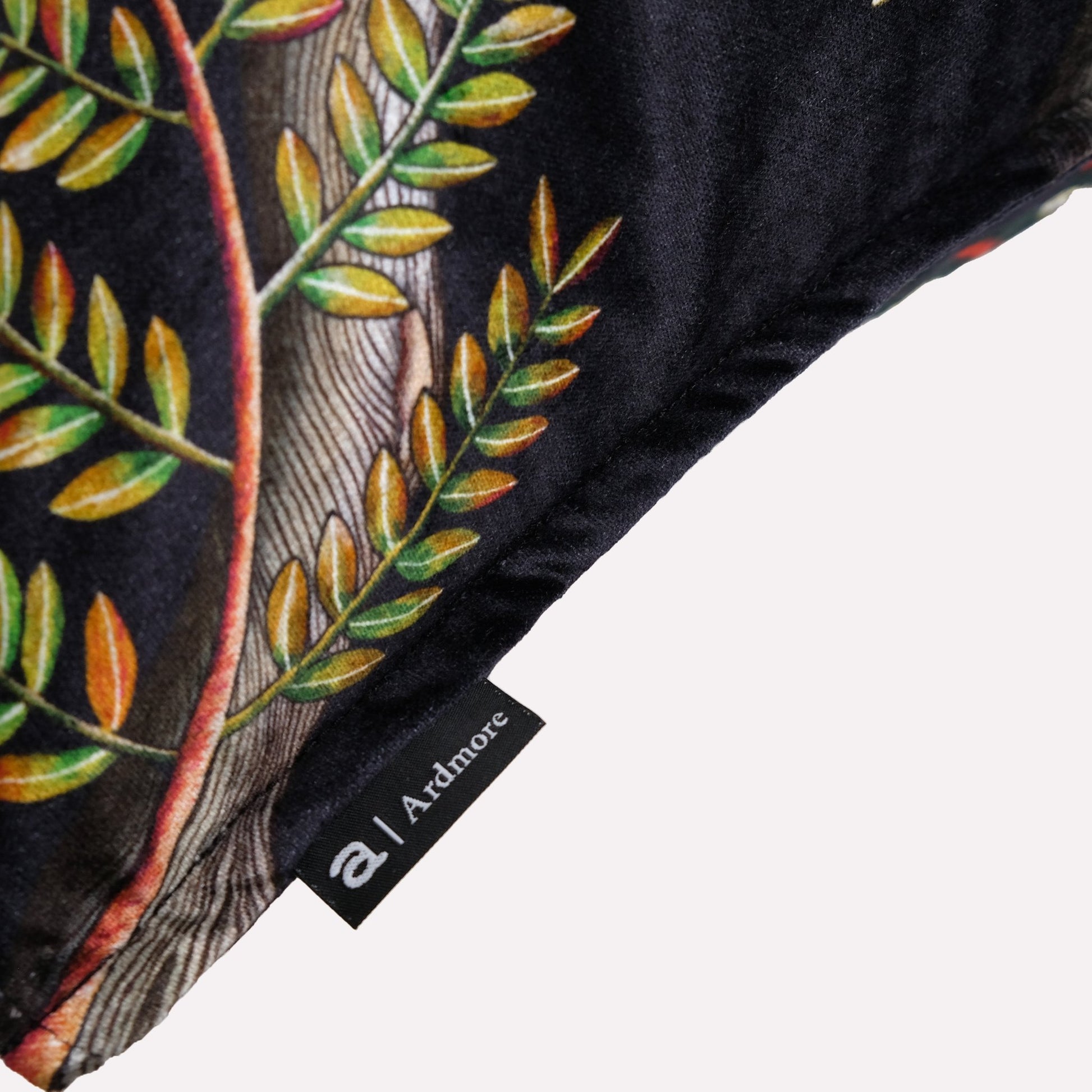 Side view of the Thanda Pangolin in Night Velvet Cushion Cover, highlighting the velvet material and piping details.