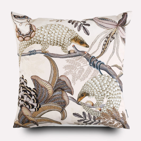 Front view of the Thanda Pangolin in Pearl Cotton Cushion Cover, featuring a captivating pangolin design surrounded by natural foliage on a cream cotton fabric.