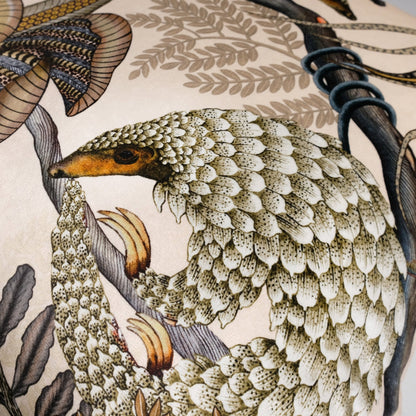 Close-up view of the Thanda Pangolin Park Pearl Velvet Cushion Cover, showcasing the exquisite pangolin design and fine attention to detail in the patterns and fabric.