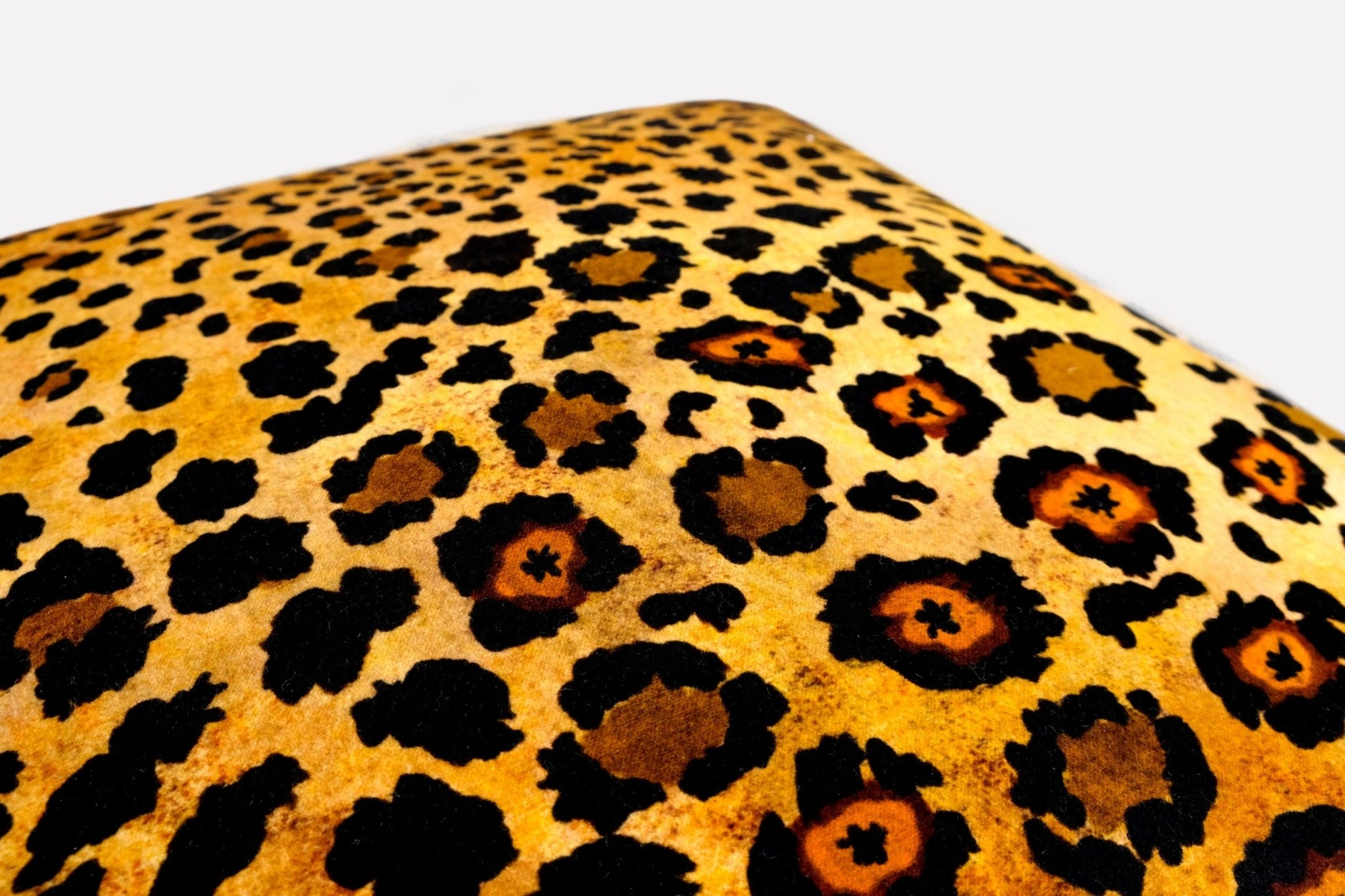 Close-up of the Safari Spot Gold Velvet Cushion Cover's corner, highlighting the premium velvet finish and intricate detailing.