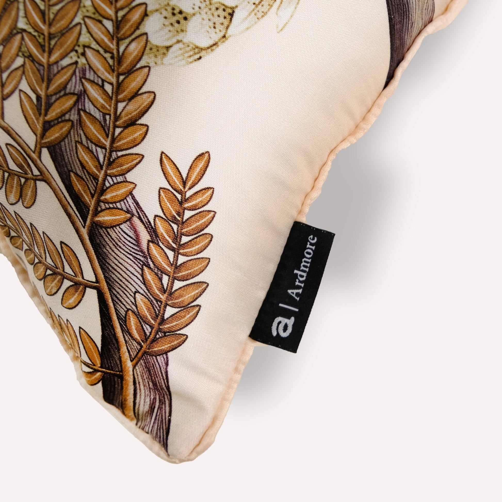 Side angle close-up of the Thanda Pangolin in Pearl Silk Cushion Cover, highlighting the premium craftsmanship and fine stitching.