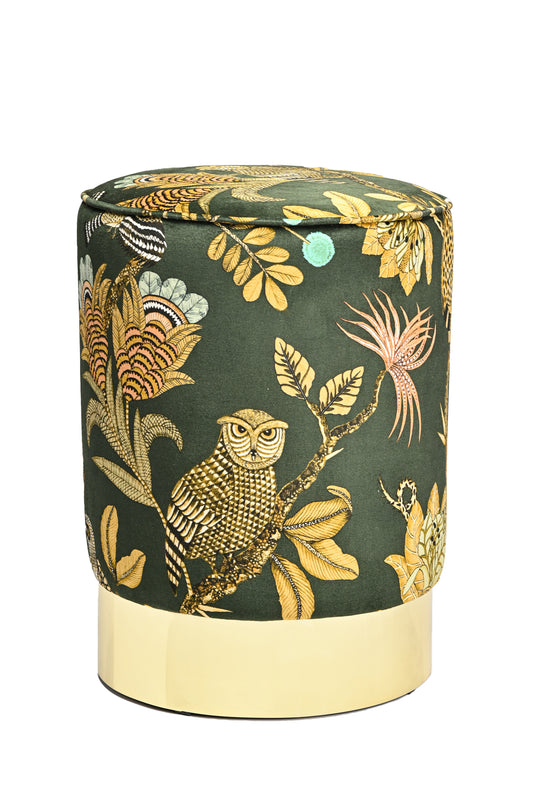 Front view of the Ardmore Camp Critter Dusk Velvet Pouffe, featuring a deep green velvet fabric adorned with intricate golden animal and botanical motifs, resting on a polished brass base.
