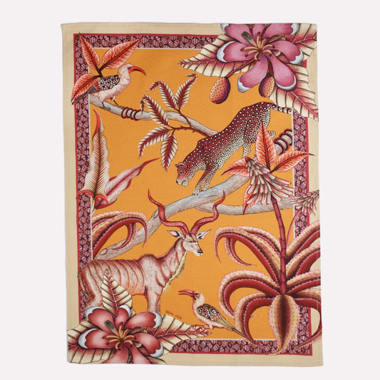 A vibrant tea towel featuring an intricate safari scene with hornbills, kudus, and leopards, set against a warm flame-orange background.