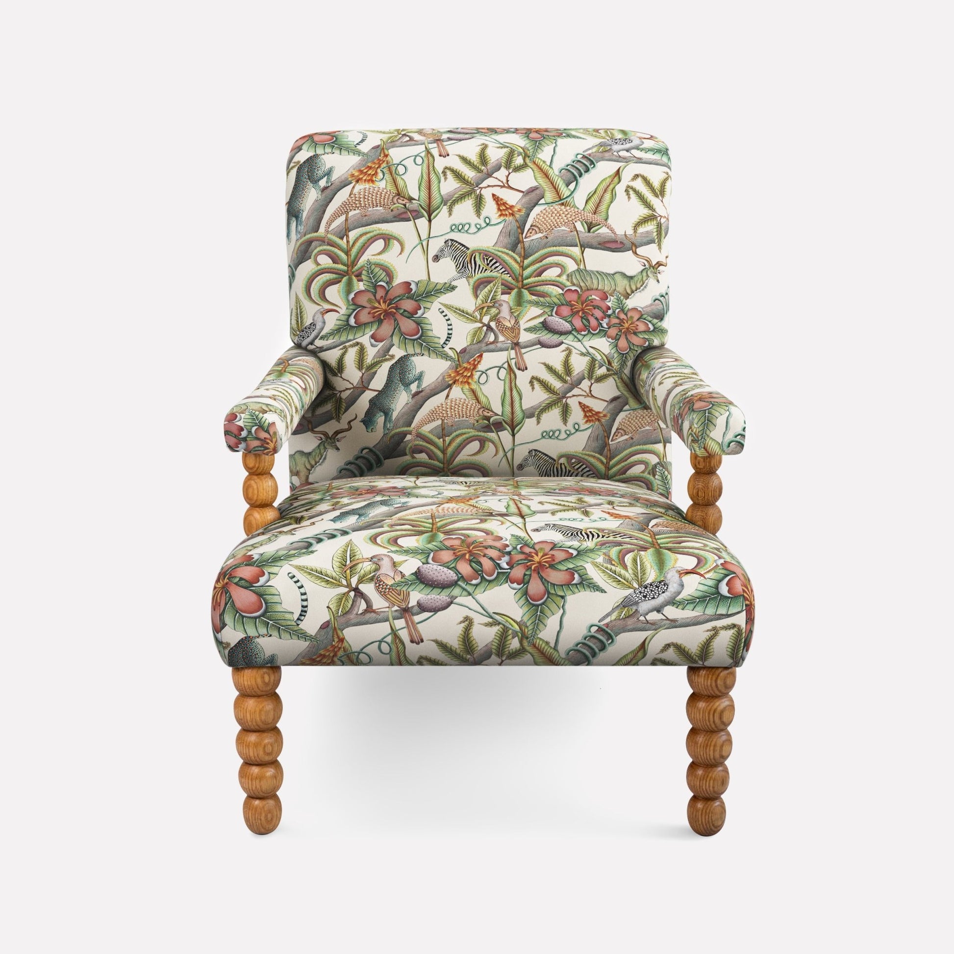 Ardmore Kudu Pod Chair in Pangolin Park Chalk Linen, featuring intricate African-inspired botanical patterns on soft linen fabric with plush cushioning and wooden legs.