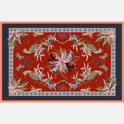 A flat lay of the Leopard Lily Tablecloth in Royal Red, featuring a rich red background with an intricate tapestry of leopards, zebras, and florals.