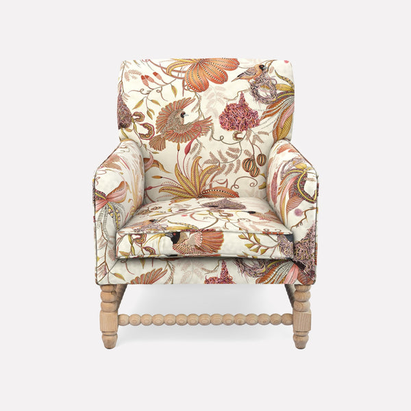 The Ardmore Lucky Bean Chair, adorned in Thanda Nests Plum Linen, features a rich botanical print in earthy tones, exuding a blend of African artistry and timeless elegance. With its curved silhouette, plush upholstery, and sturdy wooden legs, this chair offers both supreme comfort and a refined aesthetic.