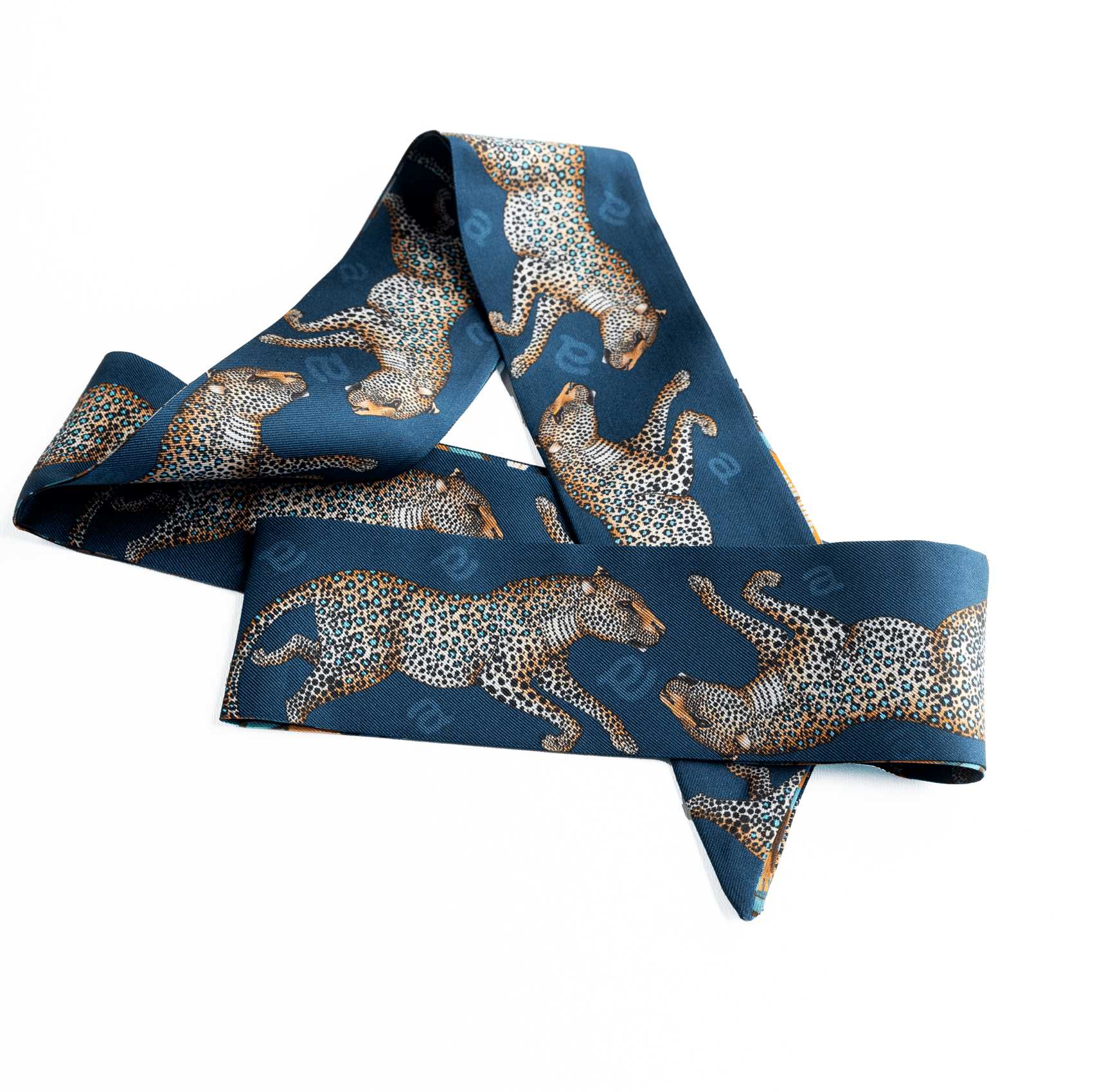 The silk twilly neatly presented in a sleek, high-end packaging box, perfect for gifting.
