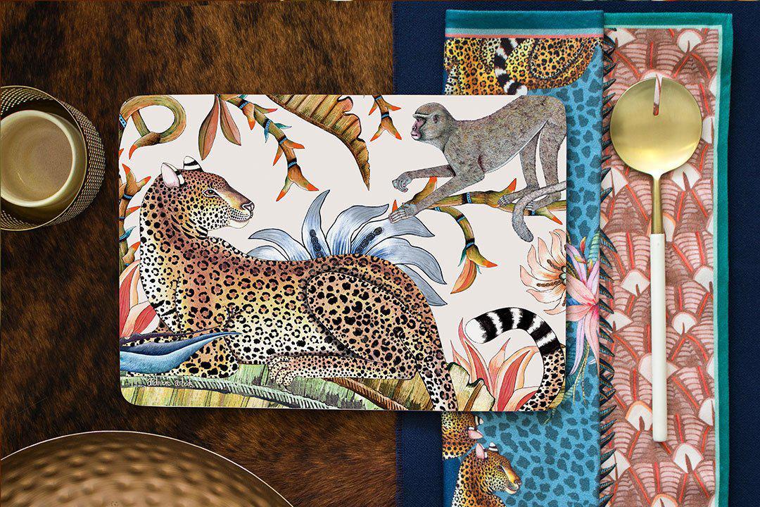 The placemat elegantly arranged on a dining table with matching decor, offering a glimpse of how it enhances a table setting with its safari-inspired aesthetic.