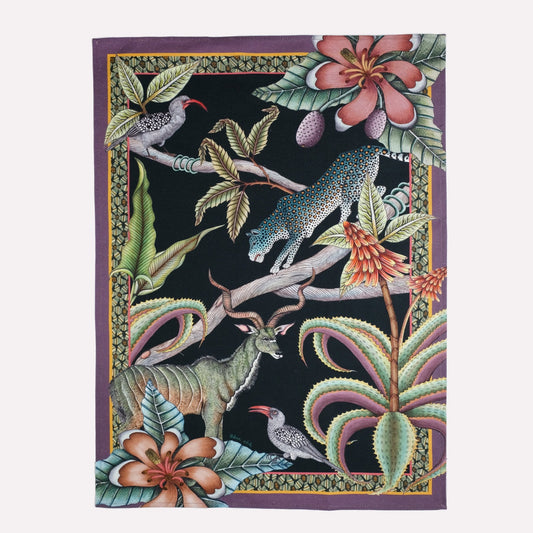 A richly detailed tea towel featuring an exotic safari-inspired design with hornbills, kudus, and leopards, set against a deep, dark background.