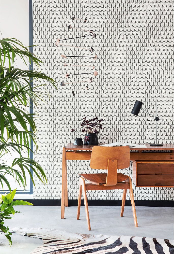 A serene, minimalistic room featuring the Narina wallpaper in a soft monochrome design, bringing a touch of refined elegance.