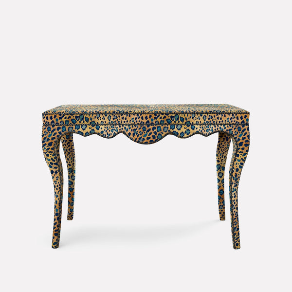 A stunning Nyala Table from Ardmore, featuring Safari Spot Midnight Linen fabric. The table’s sculptural, curved legs resemble Nyala antelope horns, while the dark, patterned upholstery adds a luxurious African-inspired aesthetic.