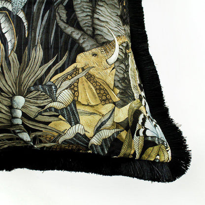 Side angle of the Sabie Forest Moonlight cushion cover, illustrating the luxurious black fringe edge and the continuation of the vibrant wildlife design along the cushion's borders.