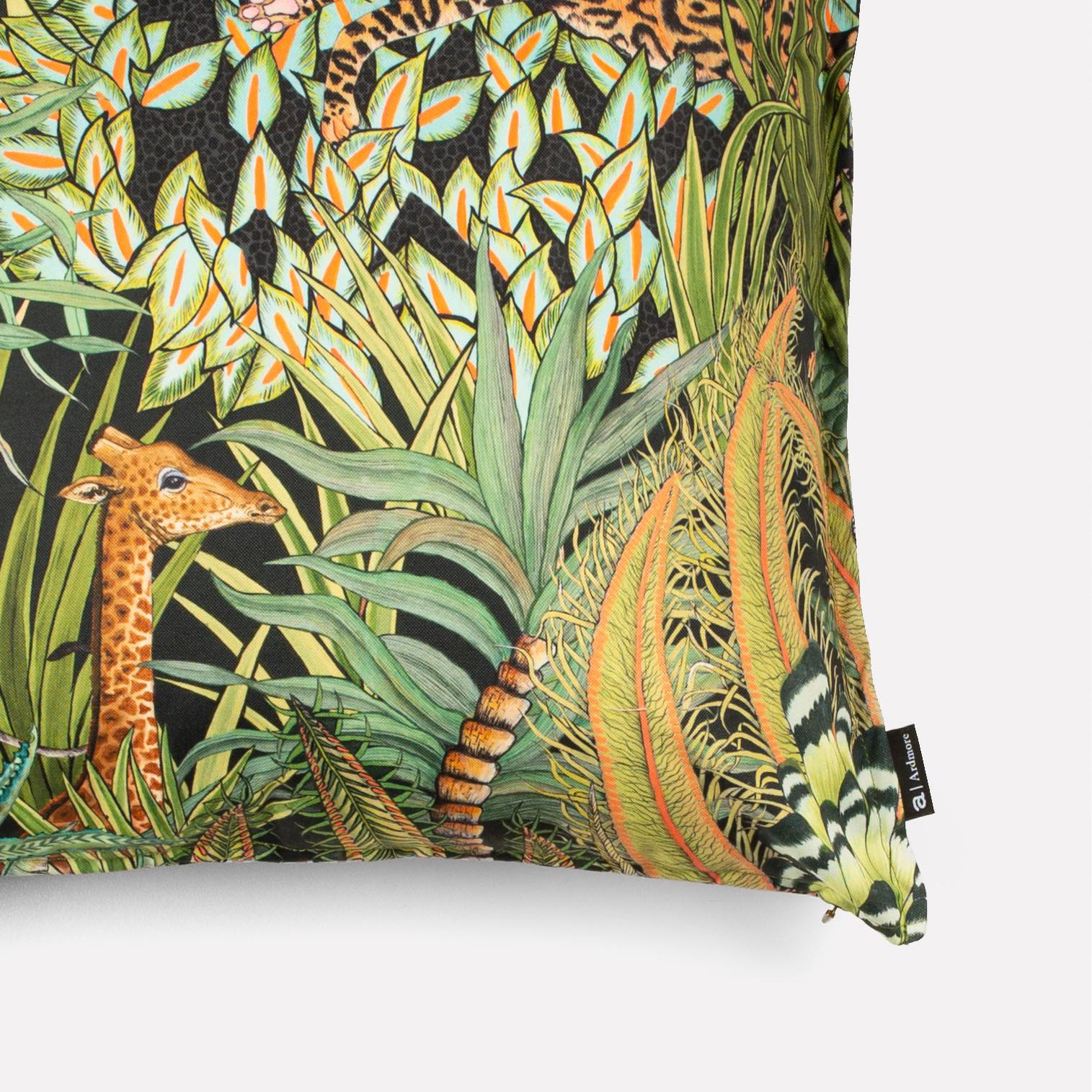Side view of the Sabie Forest Delta cushion cover, highlighting the intricate jungle-themed design and vibrant colours wrapping around the edges.