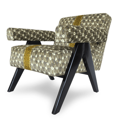  A three-quarter angle shot of the chair, displaying its plush cushioning, curved armrests, and sleek black wooden legs.