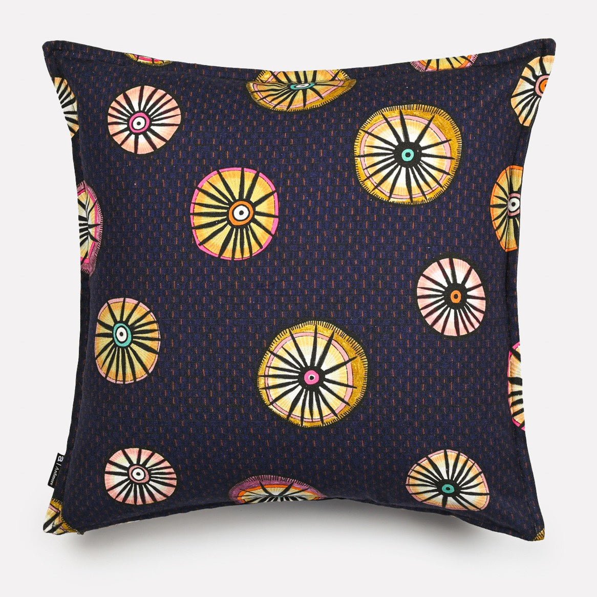 A side view of the Amasumpa Moonlight cushion, showing its slightly puffed shape and the continuation of the intricate design on both sides.