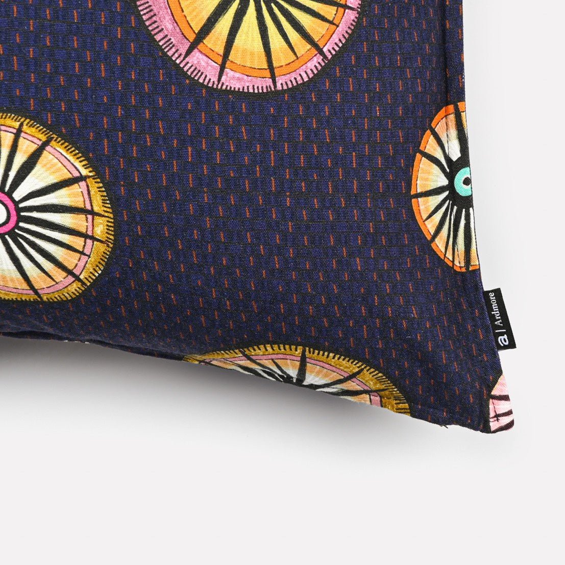 A zoomed-in shot of the cushion fabric, highlighting the vibrant circular motifs and fine digital print texture.