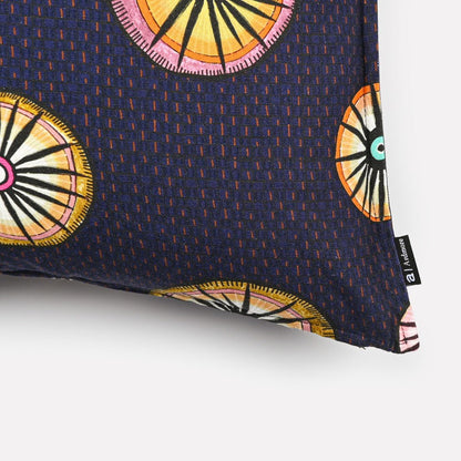A zoomed-in shot of the cushion fabric, highlighting the vibrant circular motifs and fine digital print texture.