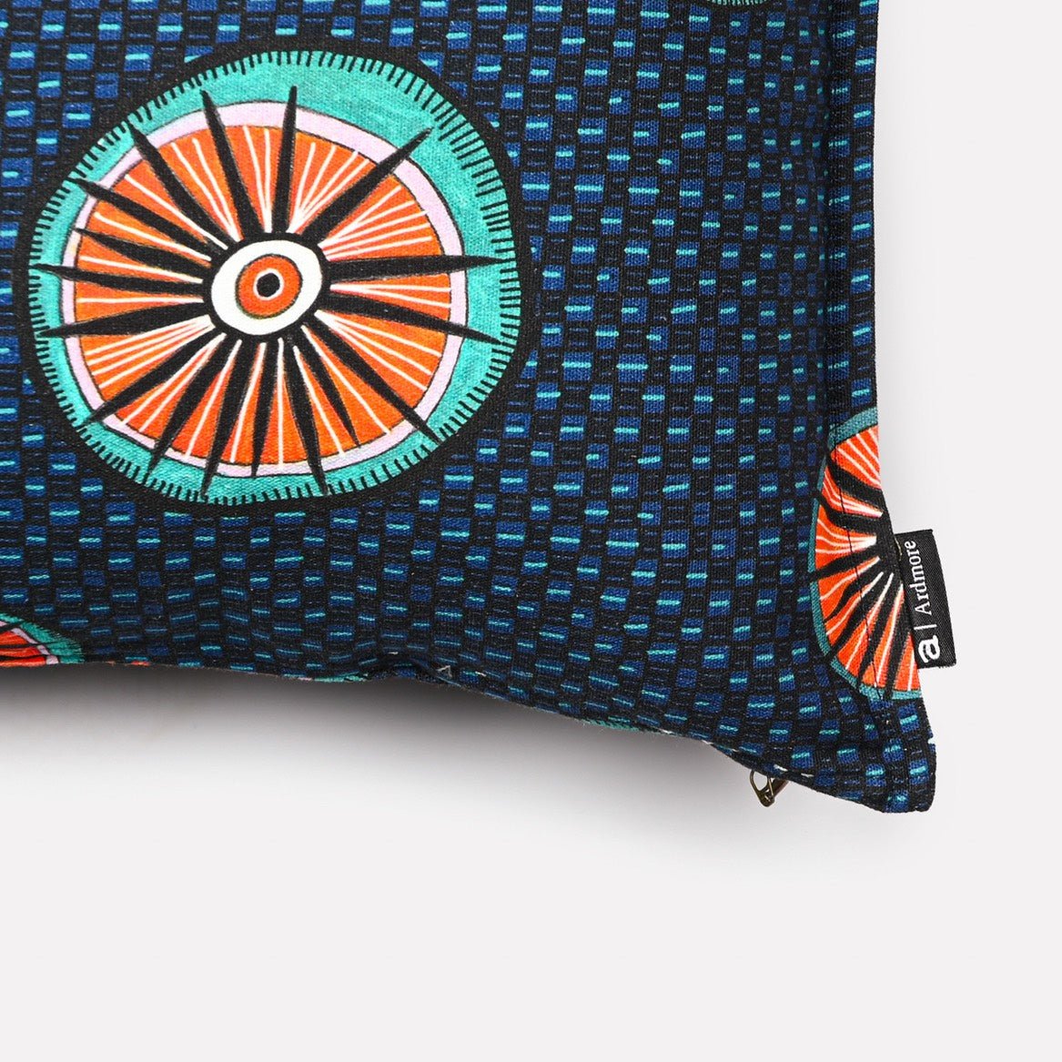 A zoomed-in section of the fabric, highlighting the precise pattern work and vibrant contrast of colours against the dark blue background.