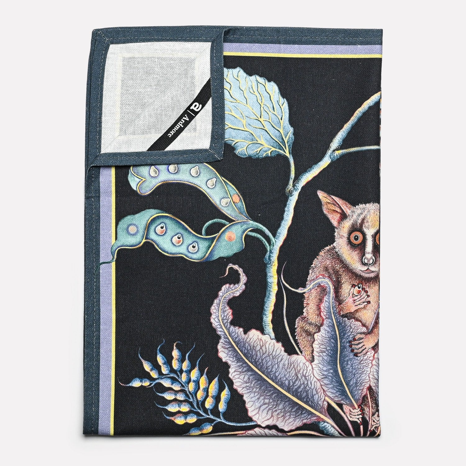 A neatly folded towel emphasising its fine craftsmanship, featuring a seamless blend of detailed illustrations and premium fabric.