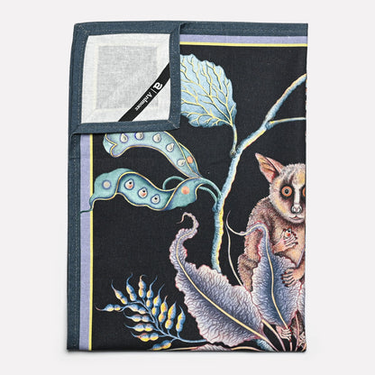 A neatly folded towel emphasising its fine craftsmanship, featuring a seamless blend of detailed illustrations and premium fabric.
