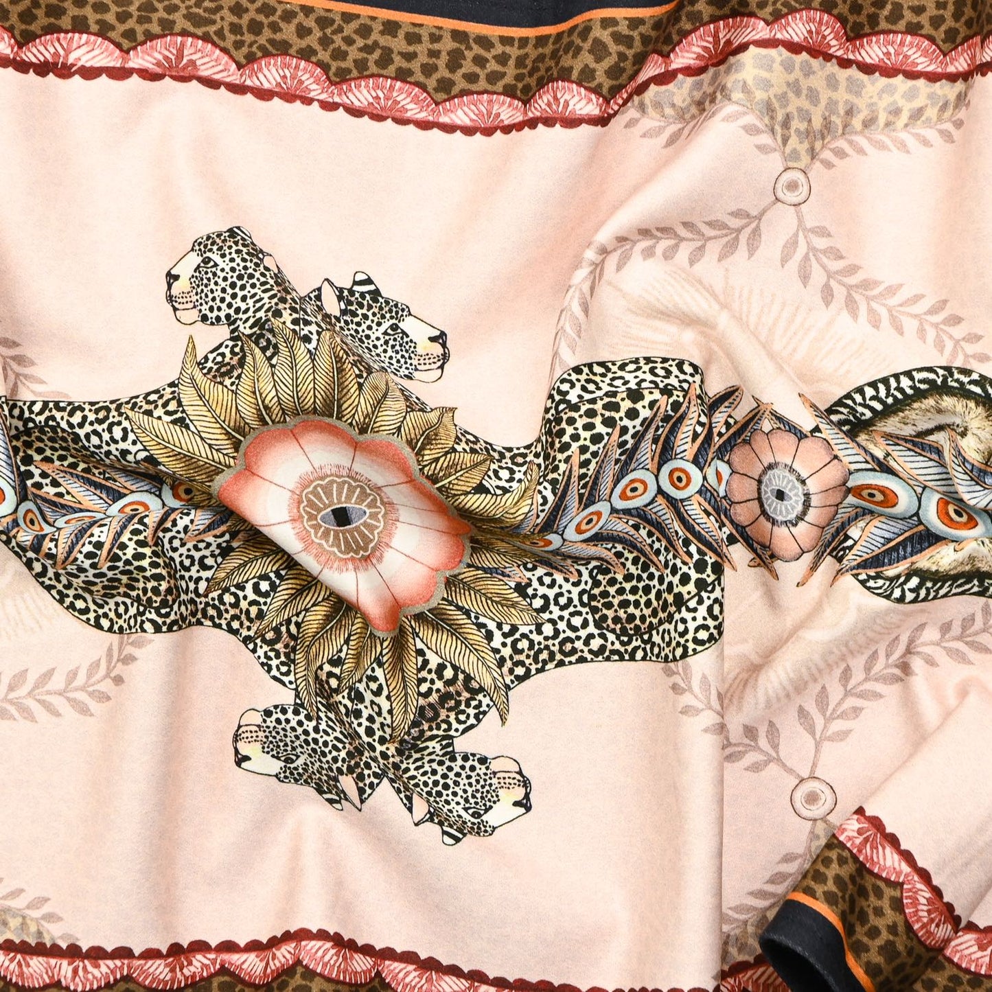 A zoomed-in section showcasing the artistic depiction of jackals and leopards amid delicate floral accents.