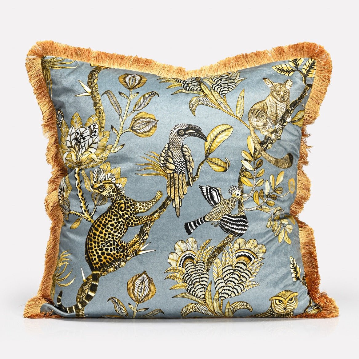 A 60x60cm cushion cover with a rich blue-grey velvet background, detailed with golden botanical and animal illustrations, and framed with plush gold fringe.