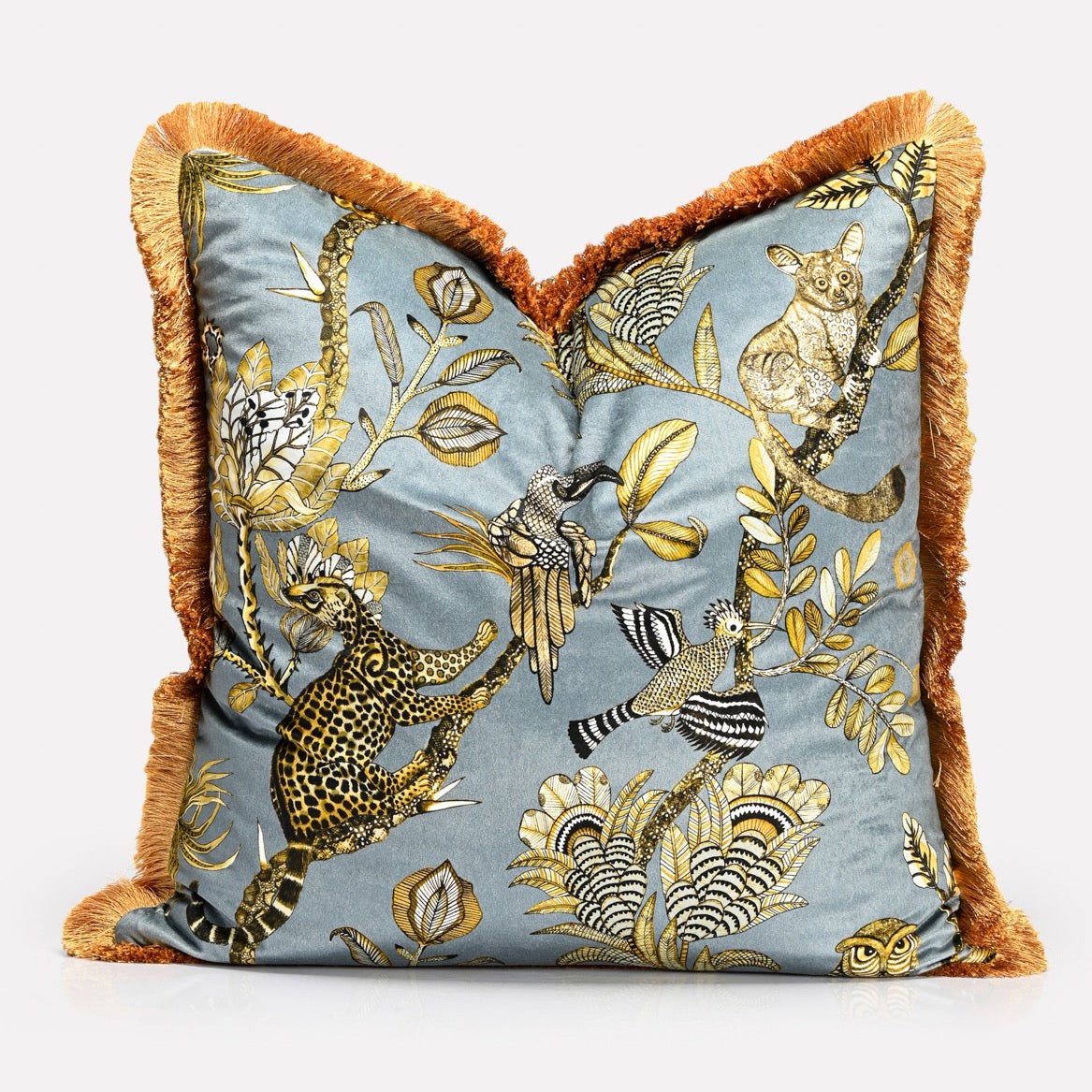 A perspective image showcasing the cushion’s luxurious fabric texture and intricate design, accentuated by the soft fringe border.