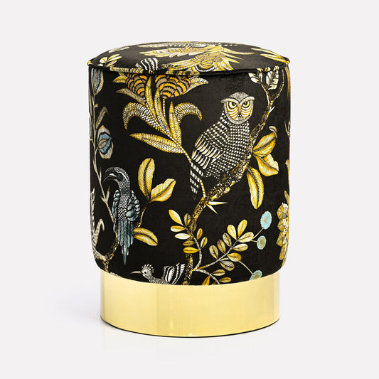 Front view of the Ardmore Camp Critter Brass Velvet Pouffe, showcasing a black velvet fabric adorned with intricate golden owl and botanical motifs, resting on a polished brass base.