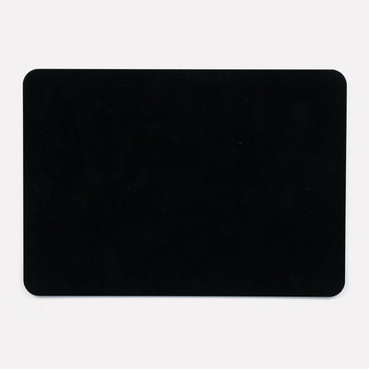 A solid black back of the placemat, showing the smooth and durable finish.