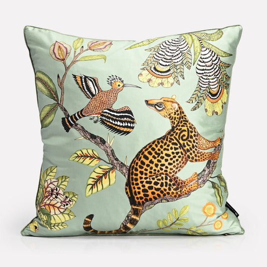 A luxurious 40x40cm silk cushion cover featuring an intricate African wildlife print with a golden leopard and exotic birds set against a pastel green background.
