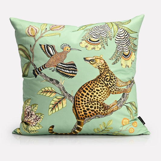 A luxurious 60x60cm velvet cushion cover featuring an intricate African wildlife print with a golden leopard and exotic birds against a soft green background.