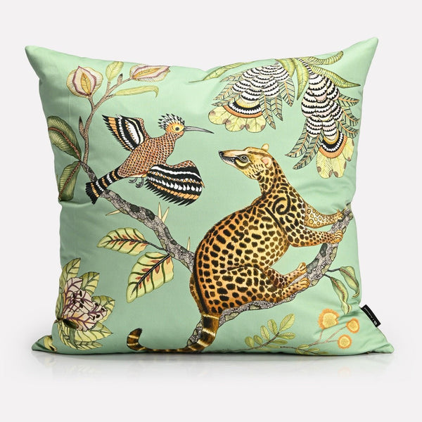 A luxurious 60x60cm velvet cushion cover featuring an intricate African wildlife print with a golden leopard and exotic birds against a soft green background.