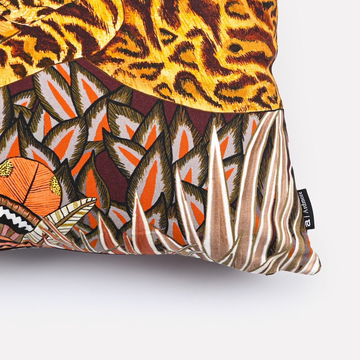 Close-up of the Cheetah Kings Forest Plum Cotton cushion cover showcasing vibrant cheetahs and rich botanical motifs.