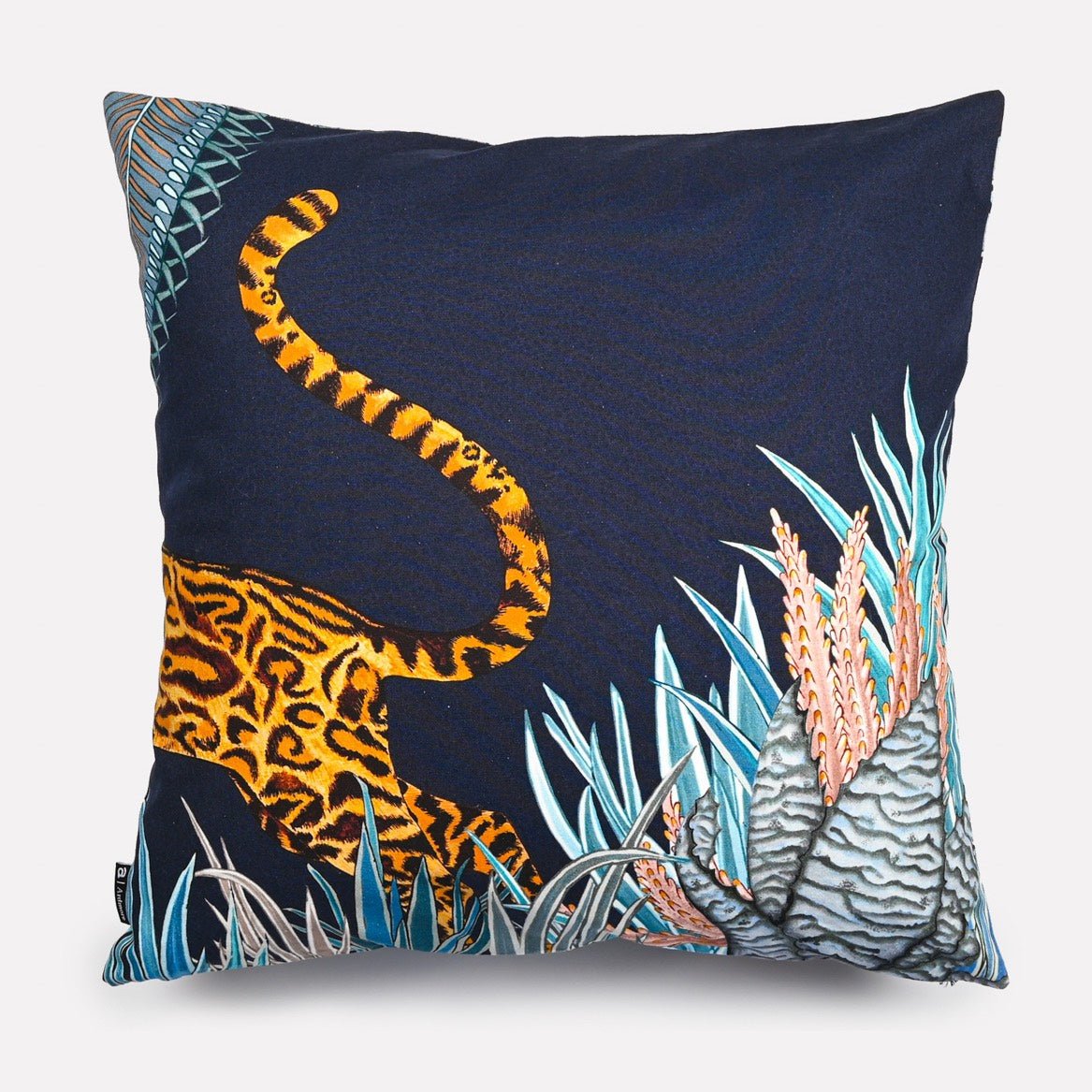 Back view of the Cheetah Kings Forest Tanzanite Cotton cushion cover showcasing a minimalist navy design with the cheetah's tail adding an artistic touch.