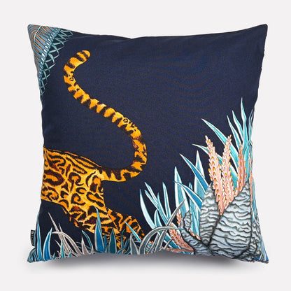 Back view of the Cheetah Kings Forest Tanzanite Cotton cushion cover showcasing a minimalist navy design with the cheetah's tail adding an artistic touch.