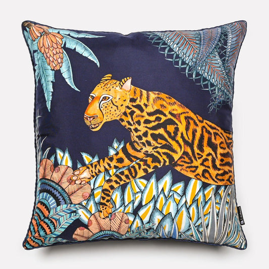 40x40cm Cheetah Kings Forest Tanzanite silk cushion cover, showcasing an intricate African-inspired cheetah design with vibrant tropical foliage on a dark blue silk background.