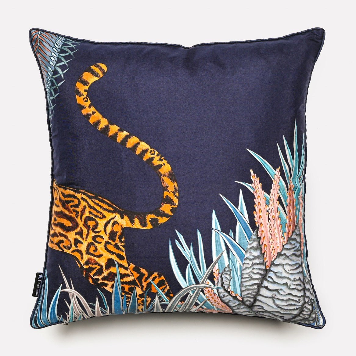 Back view of the Cheetah Kings Forest Tanzanite silk cushion cover, featuring the cheetah’s tail against a rich dark blue silk fabric.