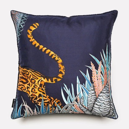 Back view of the Cheetah Kings Forest Tanzanite silk cushion cover, featuring the cheetah’s tail against a rich dark blue silk fabric.