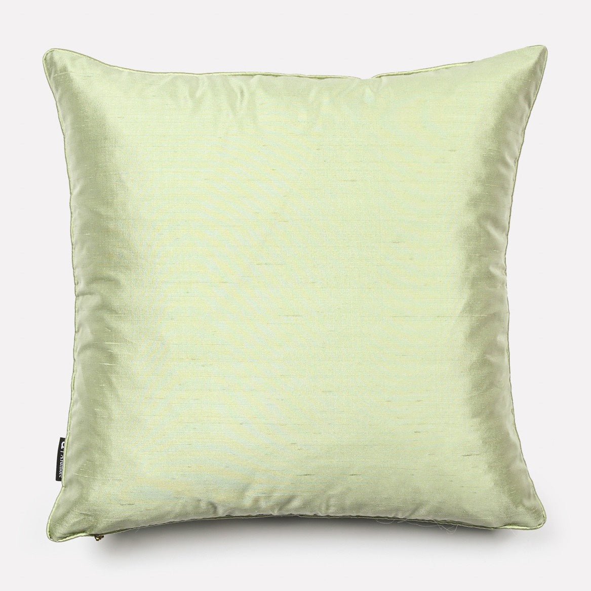 Reverse side of the Dancing Elephant Magnolia Silk cushion cover, showcasing a solid pale green silk fabric that complements the detailed front design.