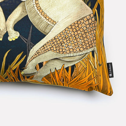 Angled close-up of the Dancing Elephant Moonlight cotton cushion cover, highlighting the fine details of the elephants and the vibrant golden grass accents on the navy cotton fabric.