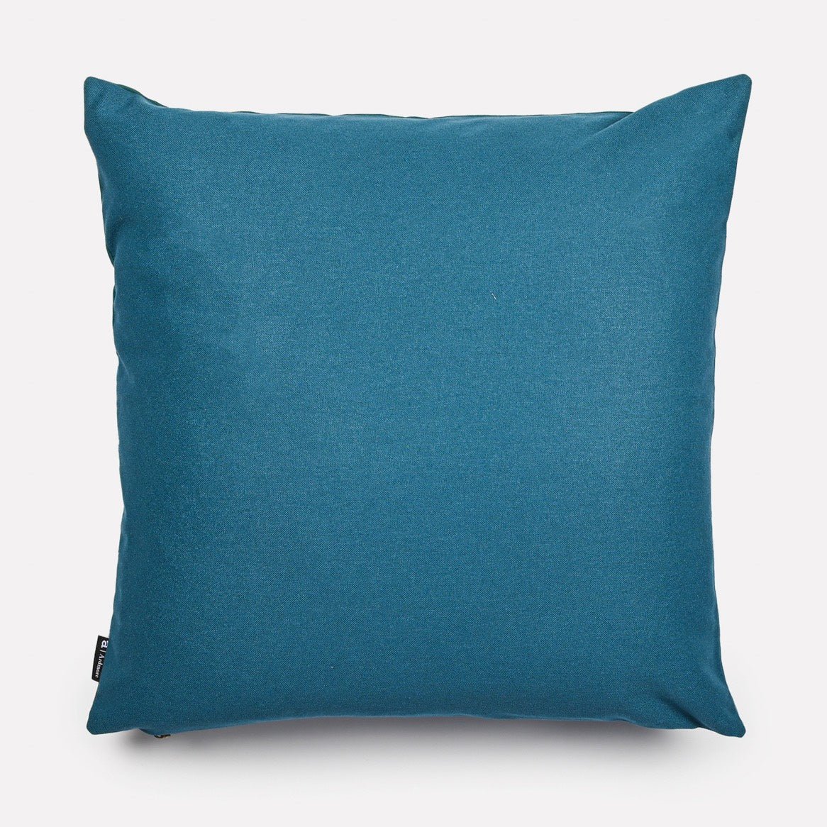 Reverse side of the Dancing Elephant Teal Lake cushion cover, showcasing a solid teal fabric that complements the design on the front.