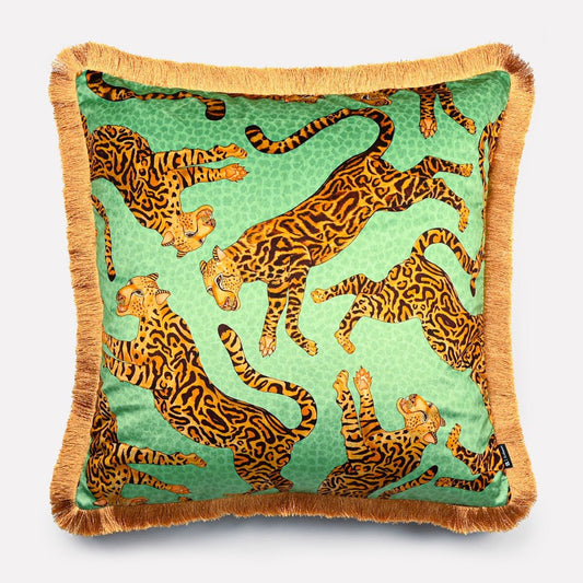 60x60cm Cheetah Kings Jade velvet cushion cover with fringe, featuring vibrant cheetah motifs in gold and brown tones on a bold jade green background, framed with a luxurious golden fringe.