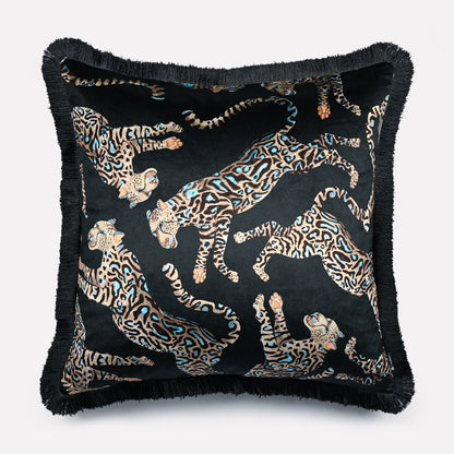 Angled view of the Cheetah Kings Starry Nights velvet cushion cover with fringe, highlighting the intricate cheetah motifs and the rich texture of the velvet fabric.