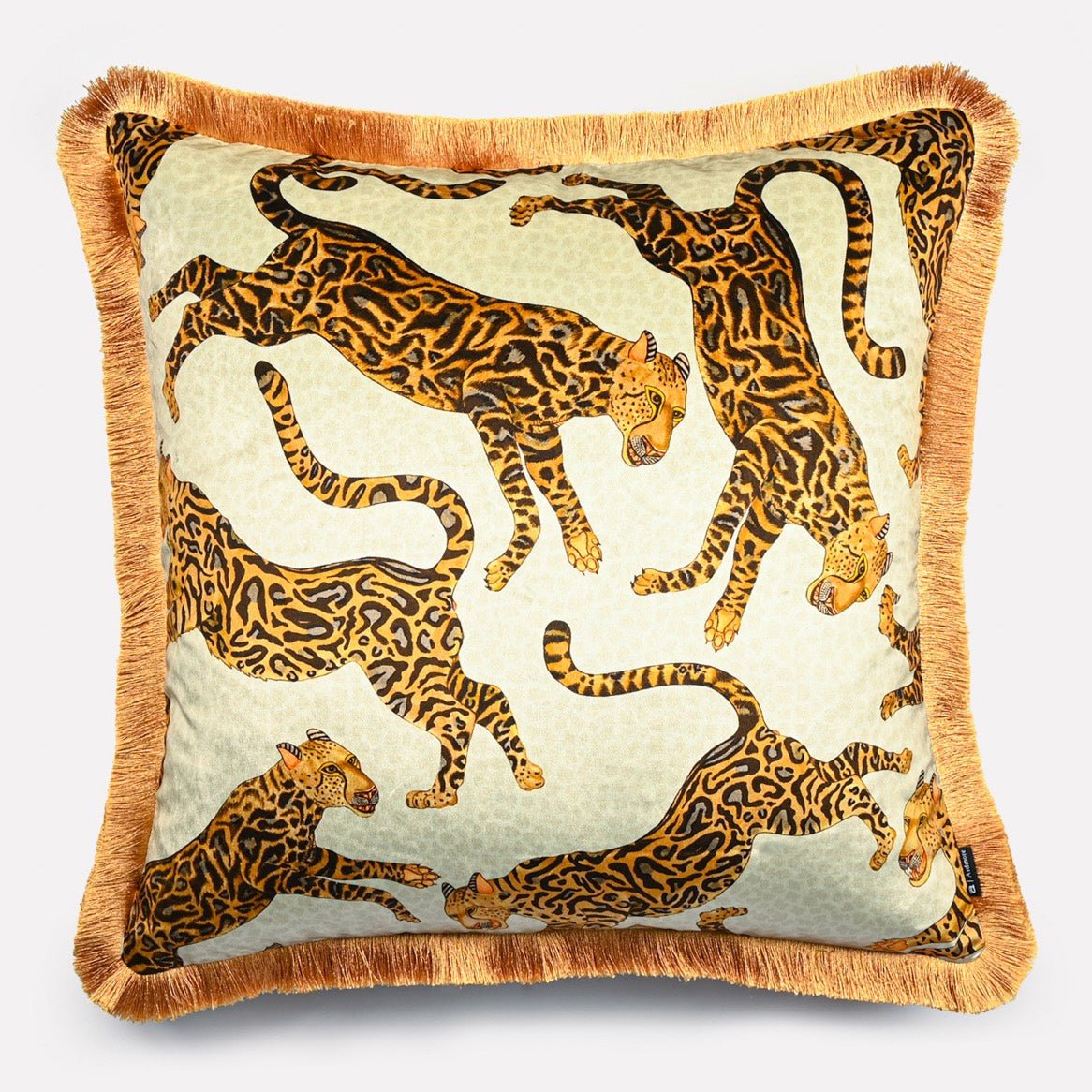 Angled view of the Cheetah Kings Stone velvet cushion cover with fringe, highlighting the intricate cheetah motifs and the soft golden fringe detailing.