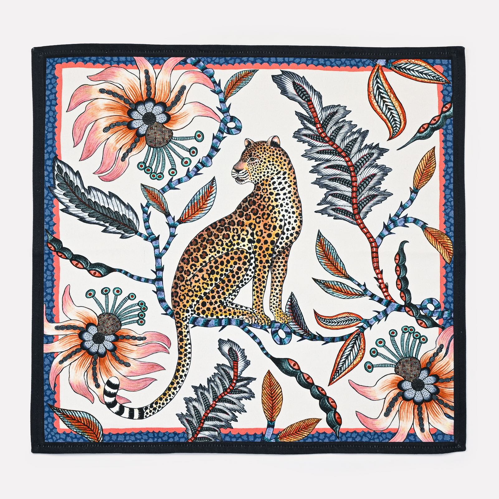 A full view of the Ardmore Leopard Napkin in Frost, showcasing a majestic leopard among passion flowers and lucky beans, framed by a deep navy border.