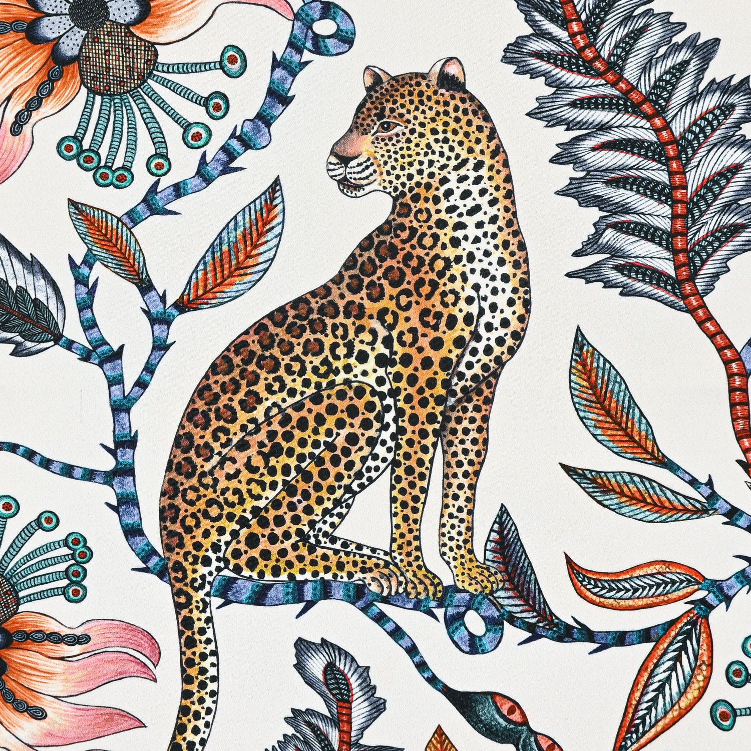 A zoomed-in section of the Ardmore Leopard Napkin in Frost, highlighting a regal leopard sitting gracefully amid intricate botanical elements.