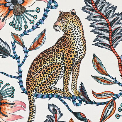 A zoomed-in section of the Ardmore Leopard Napkin in Frost, highlighting a regal leopard sitting gracefully amid intricate botanical elements.