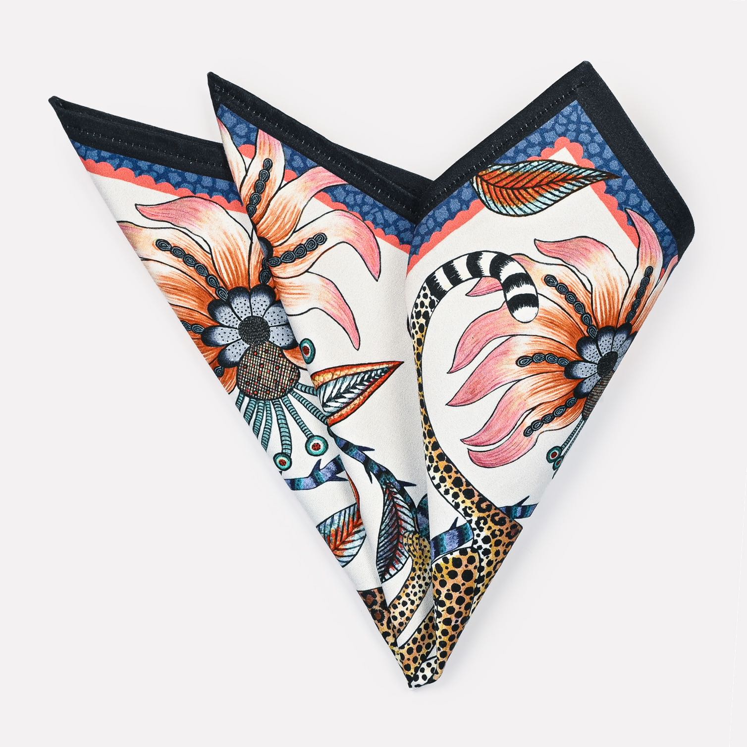 A pair of Ardmore Leopard Napkins in Frost, folded into a fan shape, displaying the elegant floral and leopard design in a mix of soft and bold hues.