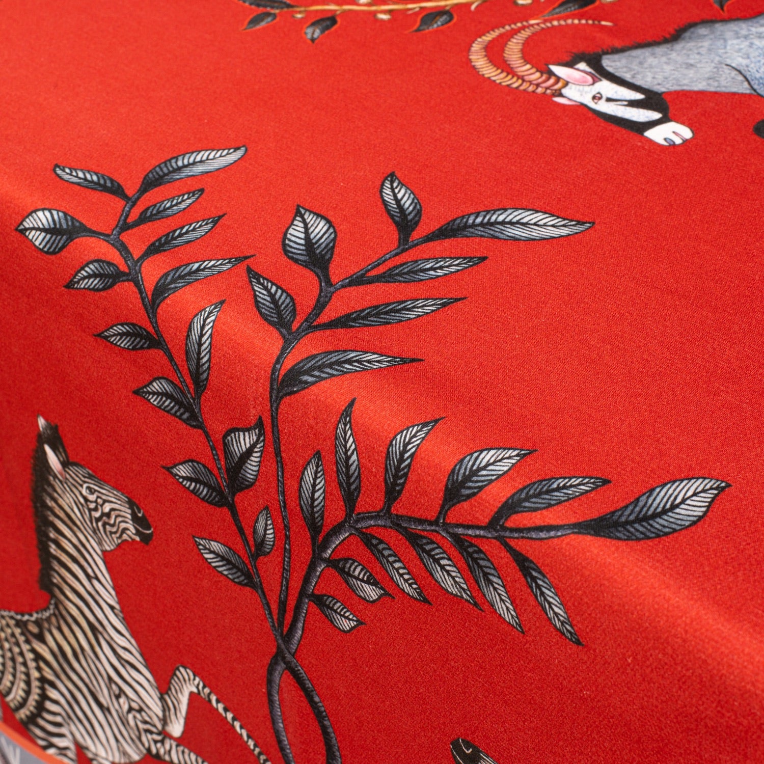 A detailed look at the border and pattern work, displaying the refined mix of florals, foliage, and animal motifs.
